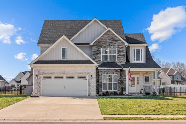 craftsman-style home featuring a front lawn, fence, board and batten siding, concrete driveway, and a shingled roof