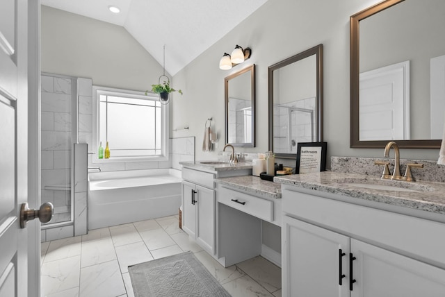 full bath featuring a sink, marble finish floor, double vanity, and vaulted ceiling