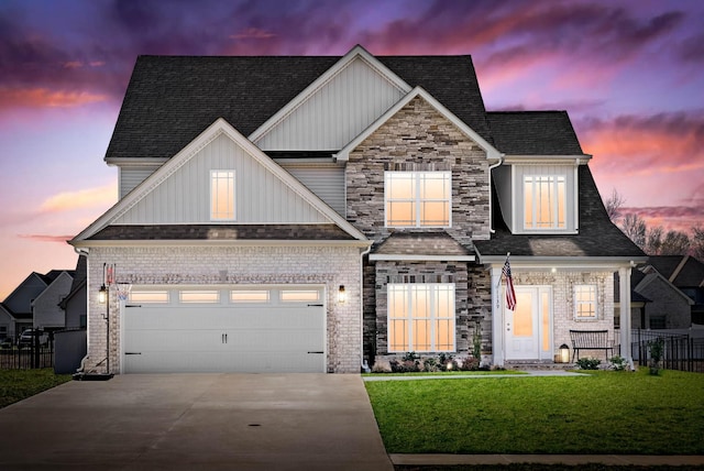 view of front of house featuring board and batten siding, a front lawn, fence, a garage, and driveway