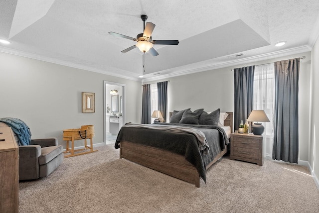 carpeted bedroom with a raised ceiling, multiple windows, crown molding, and a textured ceiling