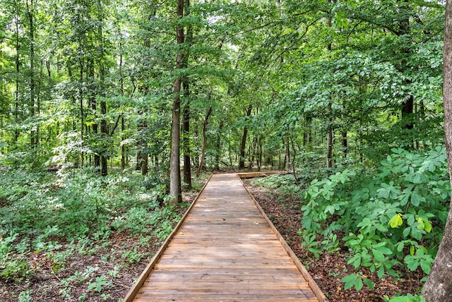 surrounding community featuring a forest view