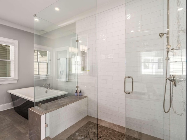 bathroom featuring a shower stall, a freestanding tub, recessed lighting, and baseboards