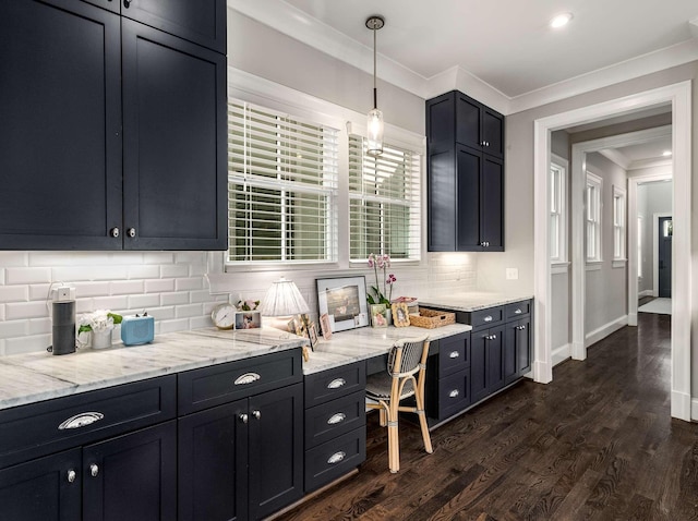 kitchen with tasteful backsplash, baseboards, dark wood finished floors, ornamental molding, and light stone counters