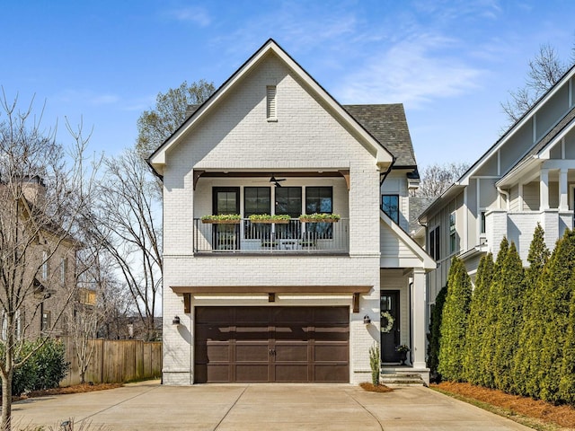 view of front of property with brick siding, driveway, an attached garage, and fence