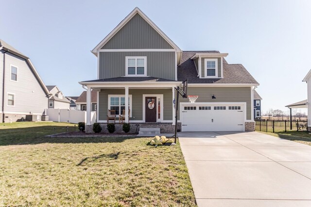 view of front of home featuring a front yard, fence, a porch, concrete driveway, and central air condition unit