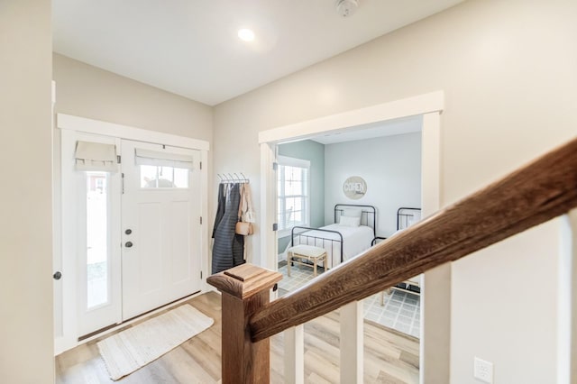 entryway with light wood-style floors