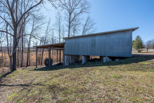 view of pole building with a lawn