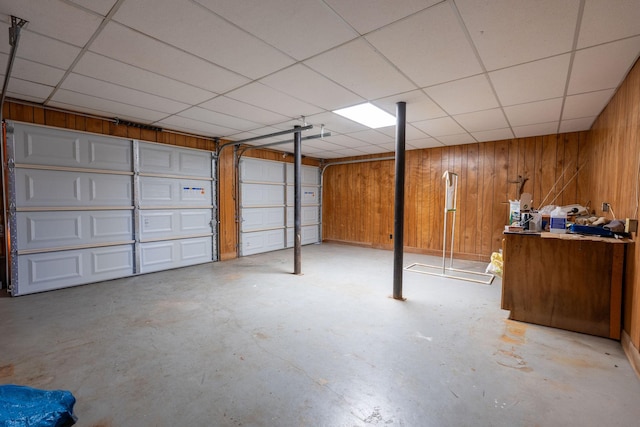 garage featuring wooden walls