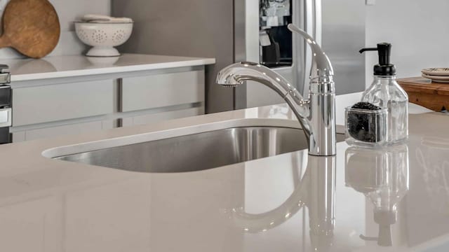 room details featuring light countertops and white cabinets