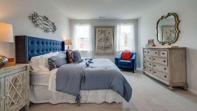 bedroom featuring carpet, visible vents, and baseboards