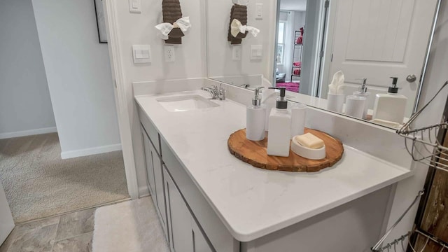 bathroom featuring vanity and baseboards