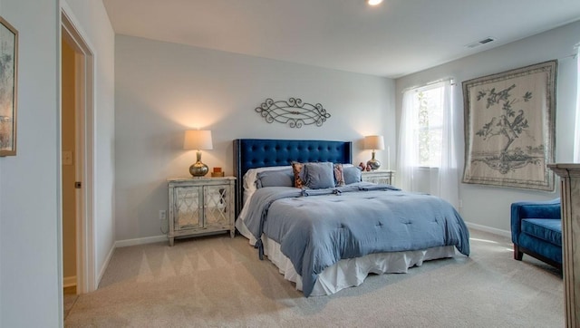 bedroom featuring visible vents, carpet floors, and baseboards