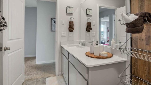 bathroom with vanity and baseboards