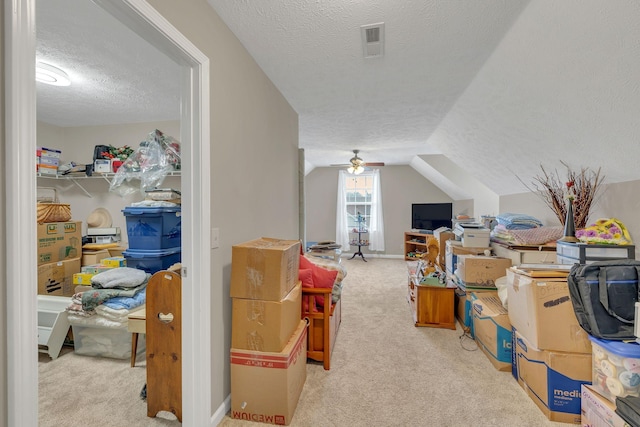 bonus room with visible vents, carpet floors, a textured ceiling, and vaulted ceiling