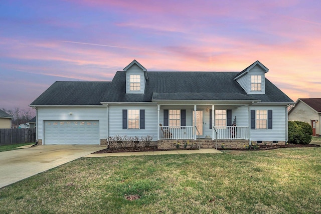 view of front of property featuring a porch, a lawn, a garage, crawl space, and driveway