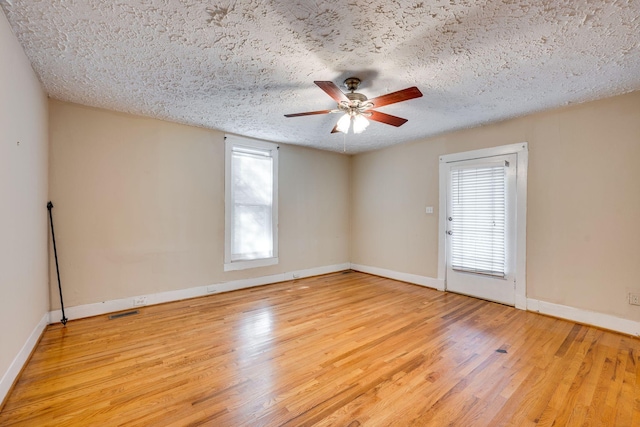 4509 Wyoming Ave, Nashville, TN 37209 - unfurnished room with wood finished floors, visible vents, baseboards, ceiling fan, and a textured ceiling