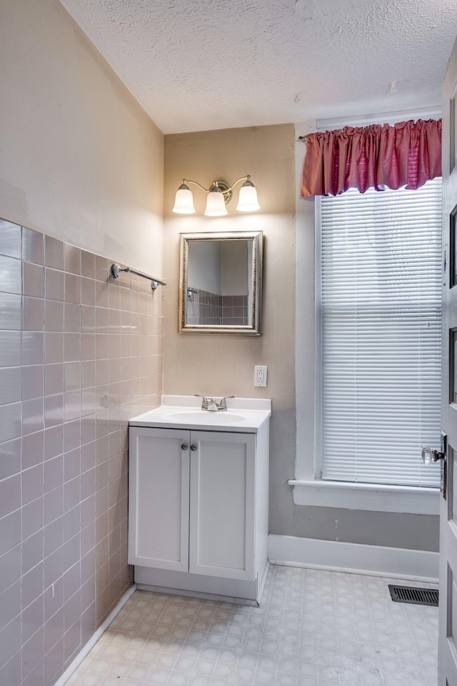 4509 Wyoming Ave, Nashville, TN 37209 - bathroom featuring tile patterned floors, visible vents, a textured ceiling, and vanity