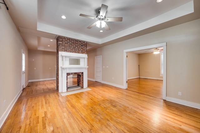 4509 Wyoming Ave, Nashville, TN 37209 - unfurnished living room with light wood finished floors, a fireplace, baseboards, and ceiling fan