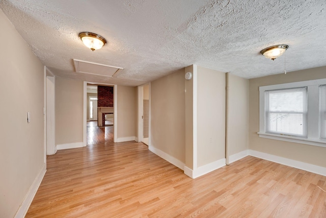 4509 Wyoming Ave, Nashville, TN 37209 - unfurnished room featuring baseboards, light wood-style floors, and a textured ceiling