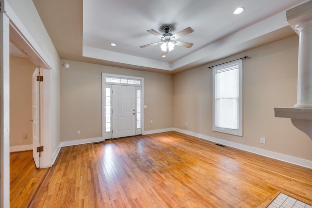 4509 Wyoming Ave, Nashville, TN 37209 - foyer with light wood finished floors, visible vents, ceiling fan, baseboards, and decorative columns