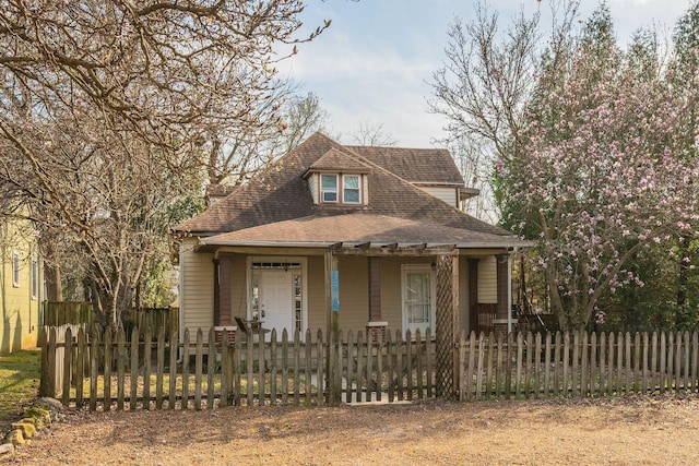 4509 Wyoming Ave, Nashville, TN 37209 - view of front of home featuring a fenced front yard, covered porch, and roof with shingles