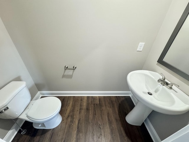 153 Cardinal Crk, Clarksville, TN 37040 - half bath with baseboards, toilet, wood finished floors, and a sink