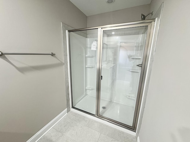 153 Cardinal Crk, Clarksville, TN 37040 - bathroom with a shower stall, baseboards, and tile patterned floors