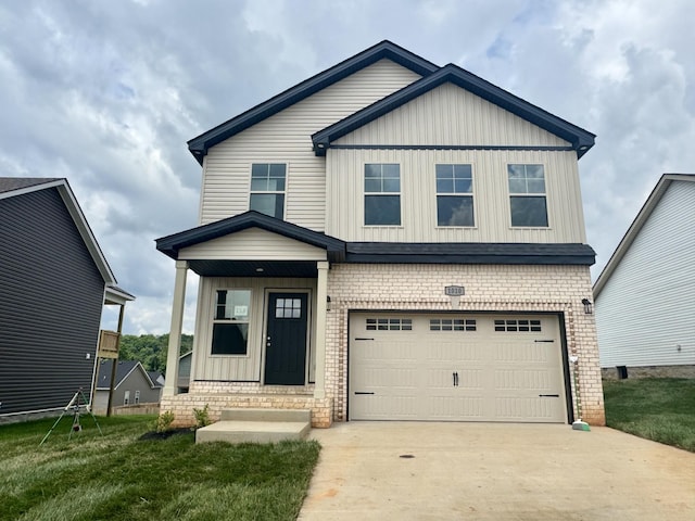 153 Cardinal Crk, Clarksville, TN 37040 - view of front of property featuring a garage, board and batten siding, concrete driveway, and a front lawn