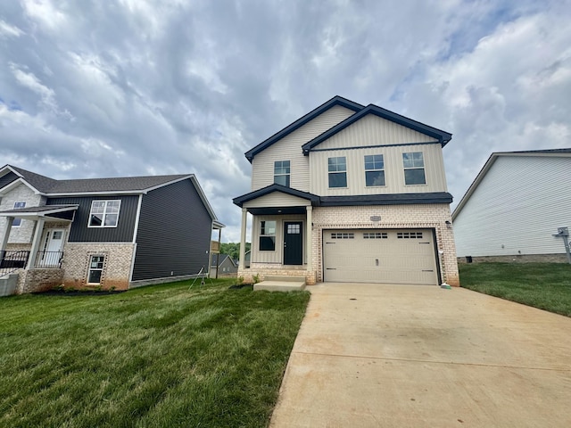 153 Cardinal Crk, Clarksville, TN 37040 - view of front facade with brick siding, driveway, a front lawn, and a garage