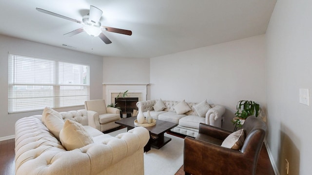 1504 Rockwood Ln, Lebanon, TN 37087 - living room with a premium fireplace, baseboards, visible vents, and ceiling fan
