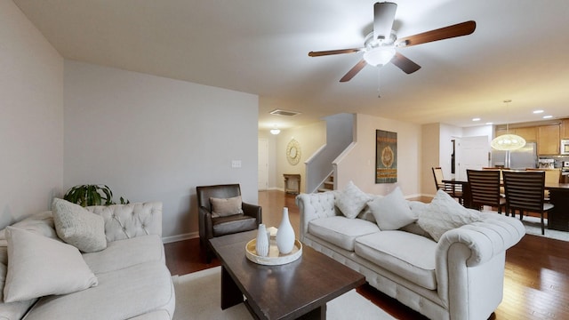 1504 Rockwood Ln, Lebanon, TN 37087 - living room with visible vents, baseboards, stairs, light wood-type flooring, and a ceiling fan