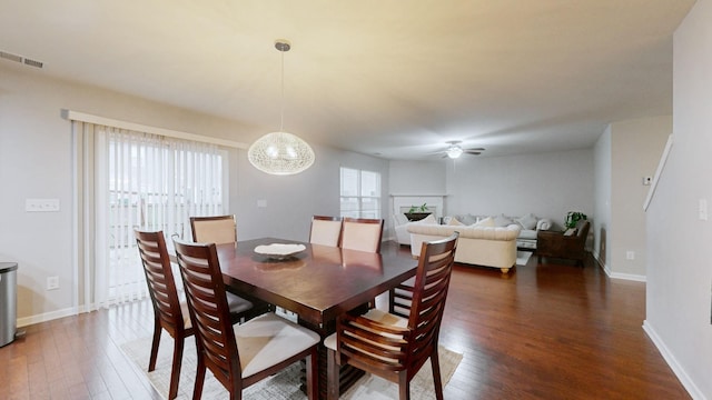 1504 Rockwood Ln, Lebanon, TN 37087 - dining area with ceiling fan with notable chandelier, dark wood-style floors, visible vents, and baseboards