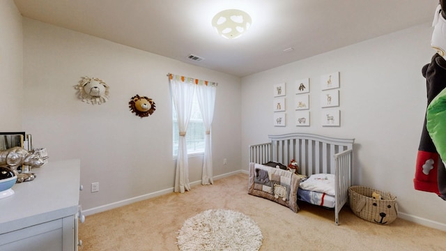 1504 Rockwood Ln, Lebanon, TN 37087 - bedroom with visible vents, baseboards, light colored carpet, and a crib