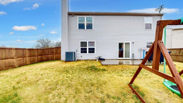 1504 Rockwood Ln, Lebanon, TN 37087 - back of house with central air condition unit, a fenced backyard, and a lawn