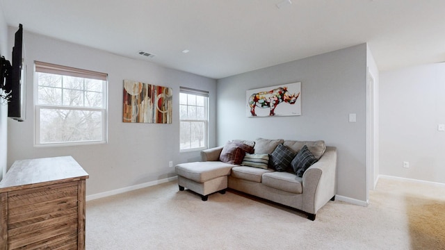 1504 Rockwood Ln, Lebanon, TN 37087 - living room featuring visible vents, baseboards, and light colored carpet