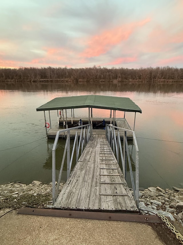dock area with a water view and boat lift