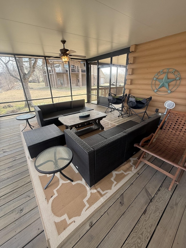 interior space with ceiling fan