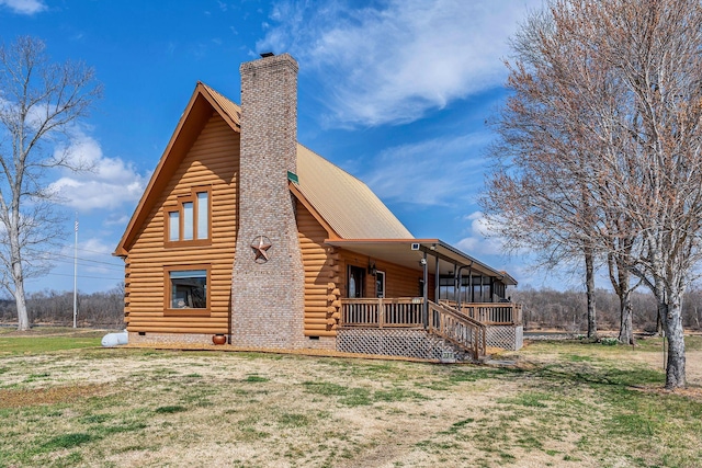 back of property with crawl space, a lawn, and covered porch