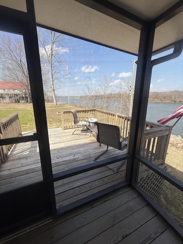 wooden deck featuring a water view