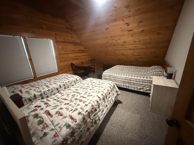carpeted bedroom with wooden walls, wooden ceiling, and vaulted ceiling