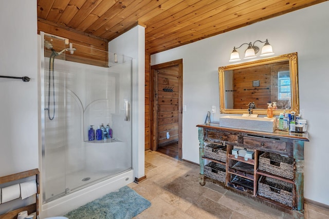 bathroom featuring wooden ceiling, vanity, and a stall shower