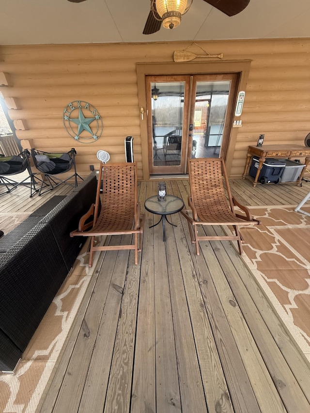 wooden terrace featuring ceiling fan