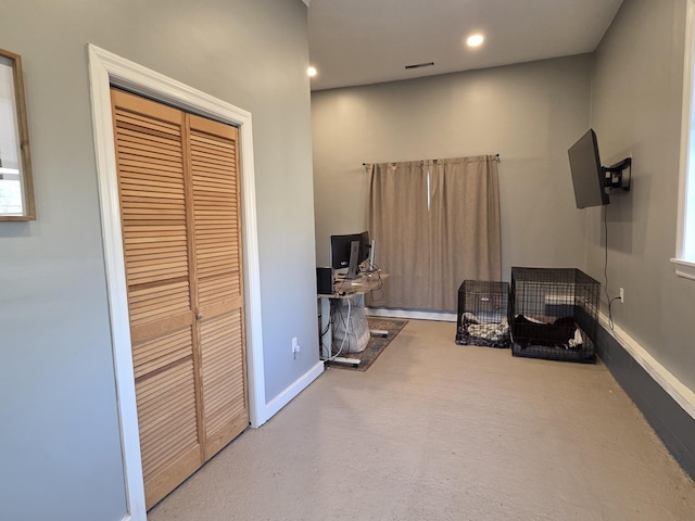 interior space with recessed lighting and baseboards