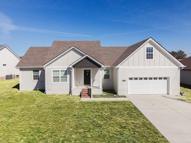 view of front of property featuring board and batten siding, concrete driveway, a front yard, a garage, and central AC unit