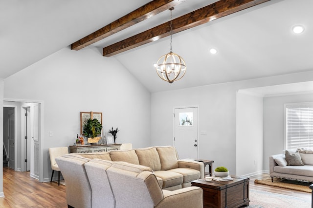 living room with light wood finished floors, recessed lighting, lofted ceiling with beams, and an inviting chandelier