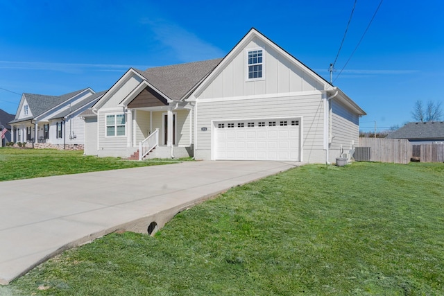 view of front of house with driveway, fence, board and batten siding, a front yard, and central AC unit