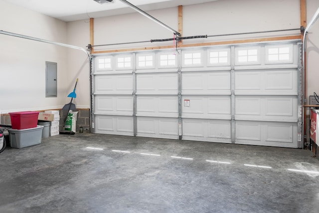 garage featuring electric panel and a garage door opener