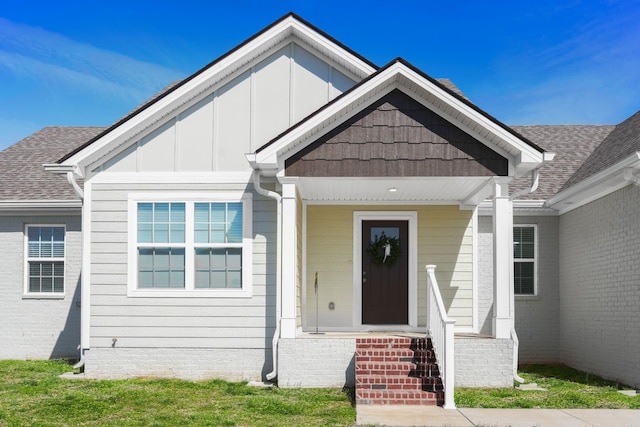 view of exterior entry featuring board and batten siding