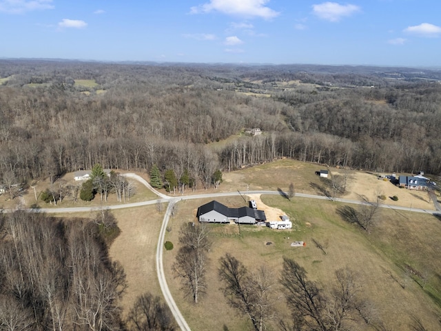 bird's eye view featuring a forest view and a rural view