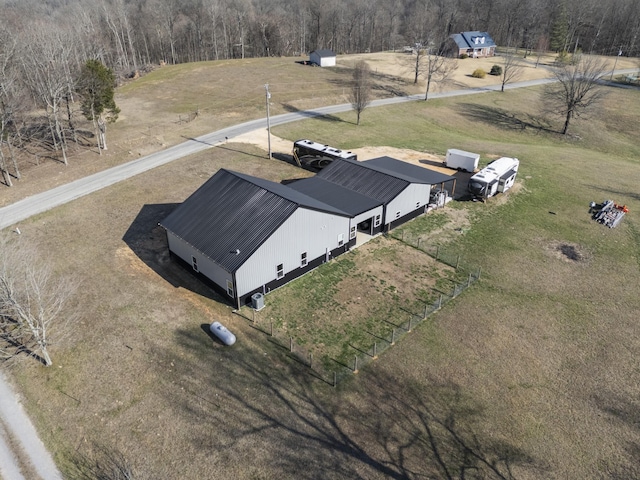 birds eye view of property with a rural view